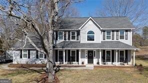 515 Walraven Rd NE, Calhoun, GA 30701 - colonial house featuring a front lawn and a porch