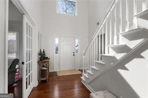515 Walraven Rd NE, Calhoun, GA 30701 - entrance foyer featuring stairway, a towering ceiling, wood finished floors, and french doors