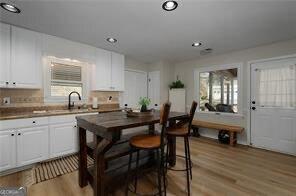 515 Walraven Rd NE, Calhoun, GA 30701 - kitchen featuring white cabinets, light wood-type flooring, and recessed lighting