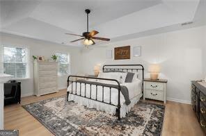 515 Walraven Rd NE, Calhoun, GA 30701 - bedroom with baseboards, a ceiling fan, wood finished floors, and a raised ceiling