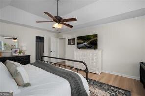 515 Walraven Rd NE, Calhoun, GA 30701 - bedroom with ceiling fan, baseboards, and wood finished floors