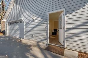 515 Walraven Rd NE, Calhoun, GA 30701 - view of property exterior featuring driveway and a garage