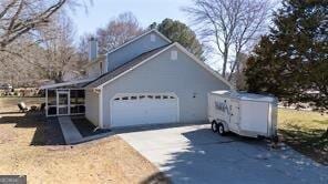 515 Walraven Rd NE, Calhoun, GA 30701 - view of side of home featuring an attached garage and driveway