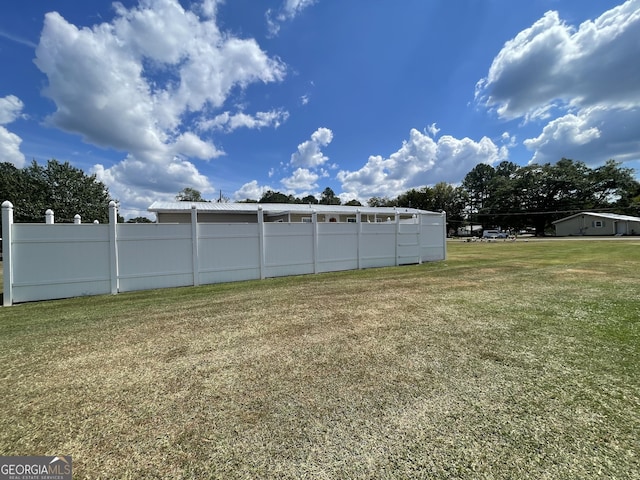 view of yard featuring fence