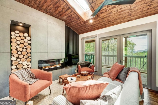 361 Rising Star Rd Unit 14, Ellijay, GA 30536 - living room with a tiled fireplace, wood ceiling, a skylight, high vaulted ceiling, and wood finished floors