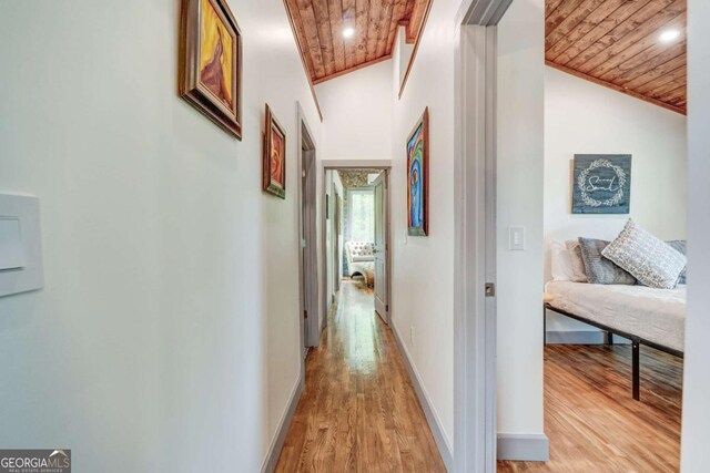 361 Rising Star Rd Unit 14, Ellijay, GA 30536 - corridor with baseboards, vaulted ceiling, light wood-style flooring, and wood ceiling