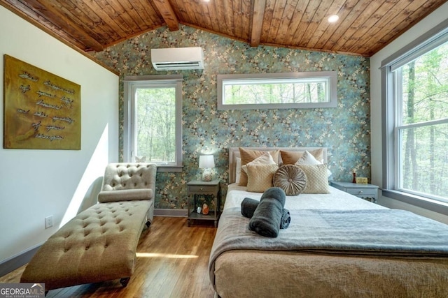 361 Rising Star Rd Unit 14, Ellijay, GA 30536 - bedroom featuring a wall mounted air conditioner, wallpapered walls, wood ceiling, wood finished floors, and lofted ceiling