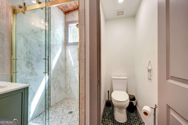 361 Rising Star Rd Unit 14, Ellijay, GA 30536 - bathroom featuring a marble finish shower, toilet, baseboards, visible vents, and vanity
