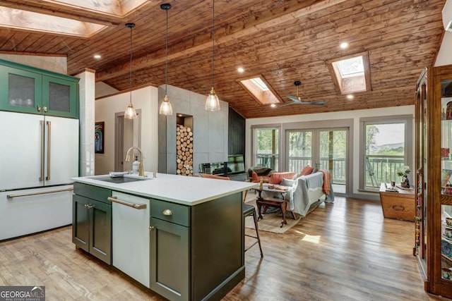 361 Rising Star Rd Unit 14, Ellijay, GA 30536 - kitchen with a skylight, white appliances, green cabinets, wooden ceiling, and vaulted ceiling