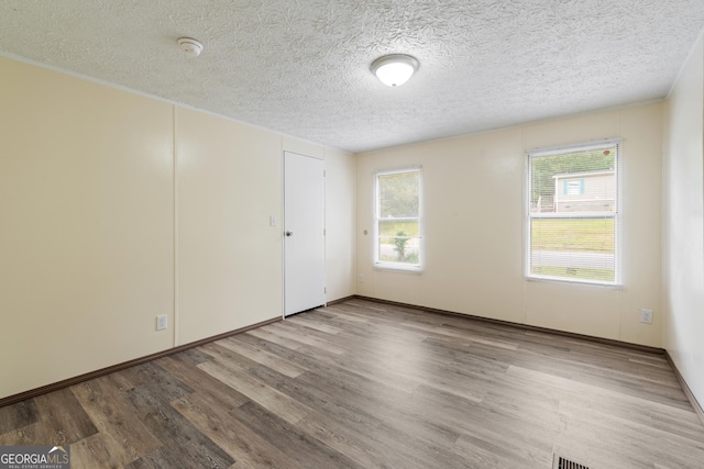 193 Pine Ridge Pl, Nicholson, GA 30565 - spare room with baseboards, wood finished floors, and a textured ceiling