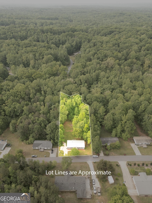 bird's eye view featuring a view of trees