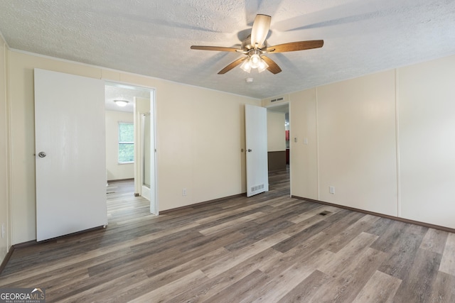 193 Pine Ridge Pl, Nicholson, GA 30565 - empty room featuring wood finished floors, a textured ceiling, ceiling fan, and visible vents