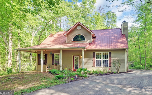 500 Old Mize Rd, Toccoa, GA 30577 - view of front of house featuring a chimney, covered porch, and metal roof