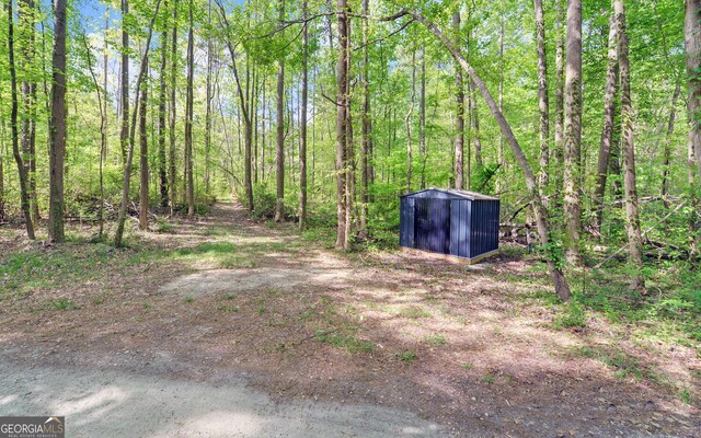 500 Old Mize Rd, Toccoa, GA 30577 - view of yard with a wooded view, an outbuilding, and a shed