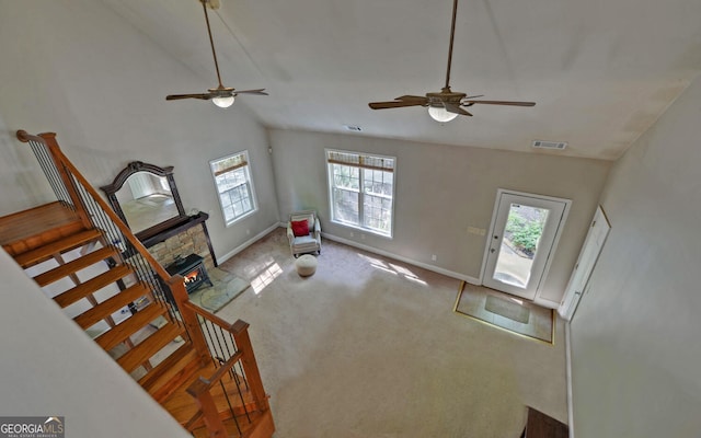 500 Old Mize Rd, Toccoa, GA 30577 - unfurnished living room with ceiling fan, carpet floors, baseboards, lofted ceiling, and visible vents