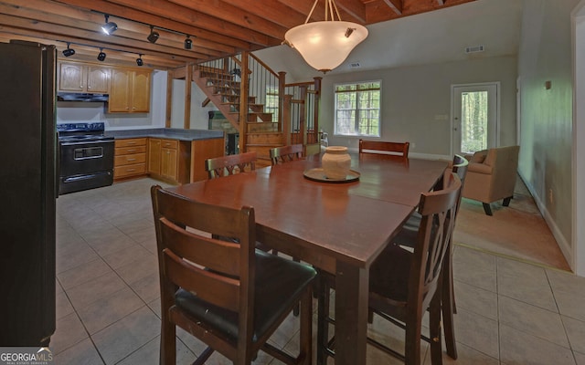 500 Old Mize Rd, Toccoa, GA 30577 - dining area with tile patterned flooring, track lighting, beamed ceiling, baseboards, and stairs
