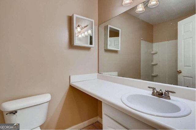 6593 Sleepy Hollow Ln, Morrow, GA 30260 - bathroom with baseboards, walk in shower, vanity, and toilet