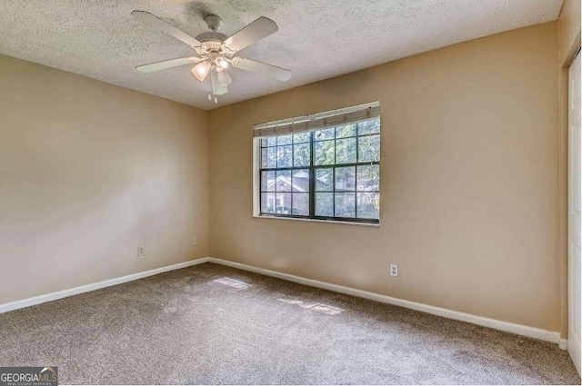 6593 Sleepy Hollow Ln, Morrow, GA 30260 - carpeted spare room with ceiling fan, baseboards, and a textured ceiling