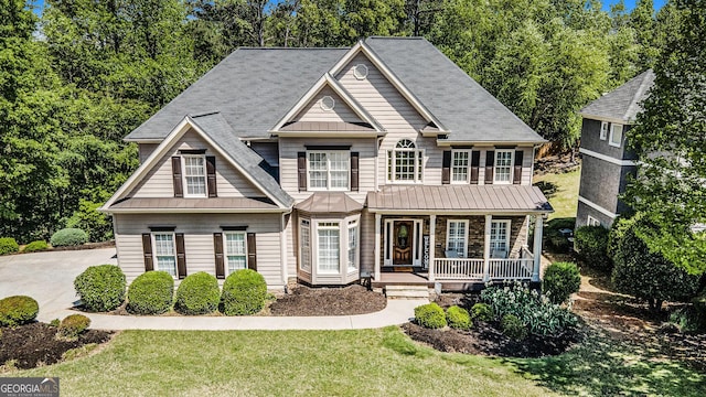 629 Gold Valley Pass, Canton, GA 30114 - view of front facade with a standing seam roof, covered porch, metal roof, and a front yard