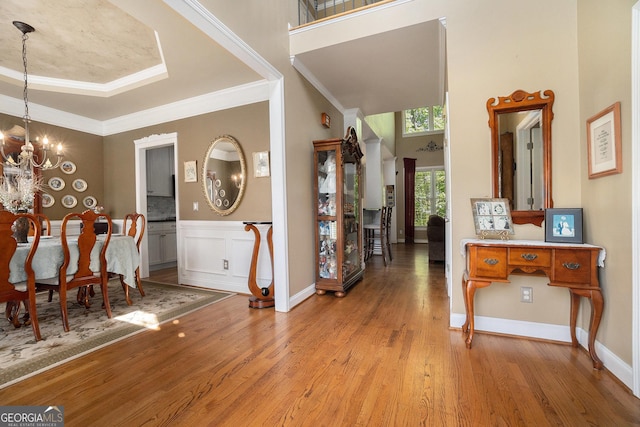 629 Gold Valley Pass, Canton, GA 30114 - entrance foyer with a high ceiling, an inviting chandelier, ornamental molding, and wood finished floors