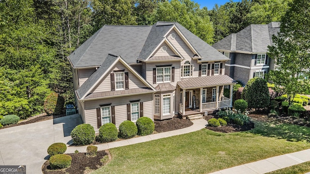 629 Gold Valley Pass, Canton, GA 30114 - craftsman-style house with roof with shingles, a front lawn, a standing seam roof, covered porch, and metal roof