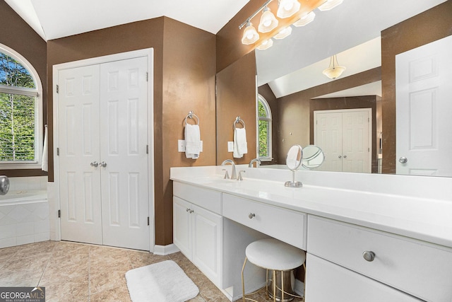 629 Gold Valley Pass, Canton, GA 30114 - bathroom with vanity, a closet, a bath, and lofted ceiling