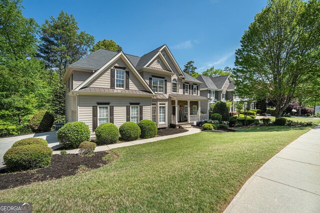 629 Gold Valley Pass, Canton, GA 30114 - craftsman inspired home featuring a front lawn, metal roof, and a standing seam roof