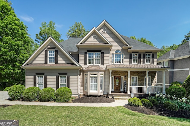 629 Gold Valley Pass, Canton, GA 30114 - view of front facade with a porch, a standing seam roof, and metal roof