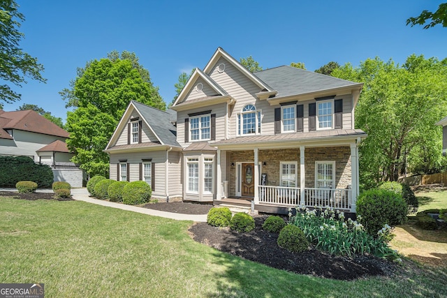 629 Gold Valley Pass, Canton, GA 30114 - colonial-style house with a front lawn, covered porch, stone siding, and a standing seam roof