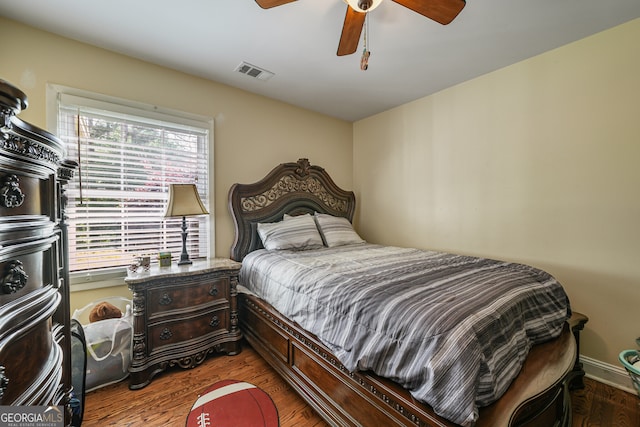 bedroom featuring wood finished floors and ceiling fan