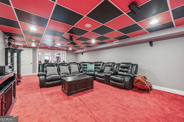 cinema room with carpet floors and baseboards