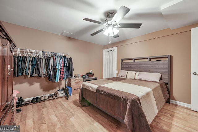 bedroom with wood finished floors and a ceiling fan