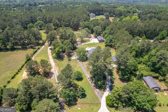 aerial view of property's location with a forest