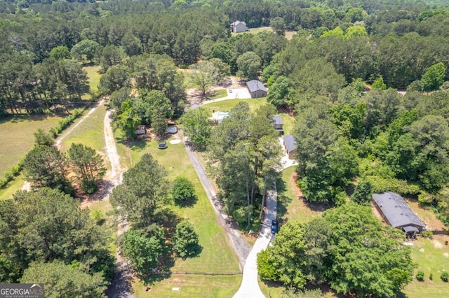 aerial overview of property's location featuring a heavily wooded area