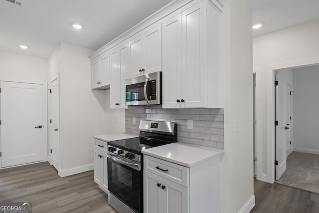 130 Rudders Xing, Newnan, GA 30263 - kitchen featuring baseboards, stainless steel appliances, light countertops, and light wood-style floors