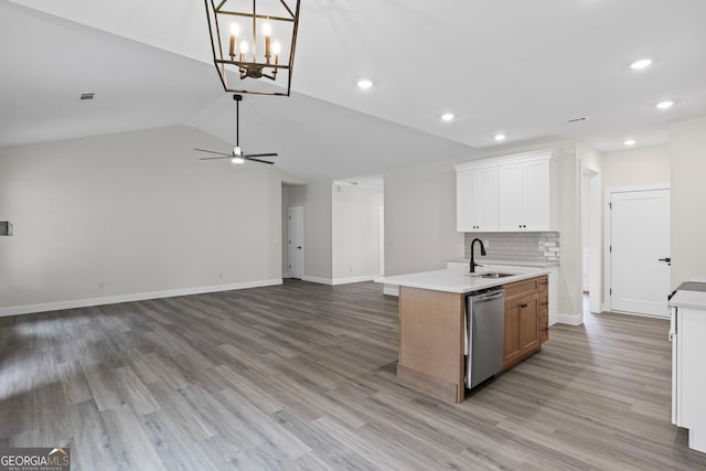 130 Rudders Xing, Newnan, GA 30263 - kitchen featuring light countertops, a sink, open floor plan, backsplash, and dishwasher