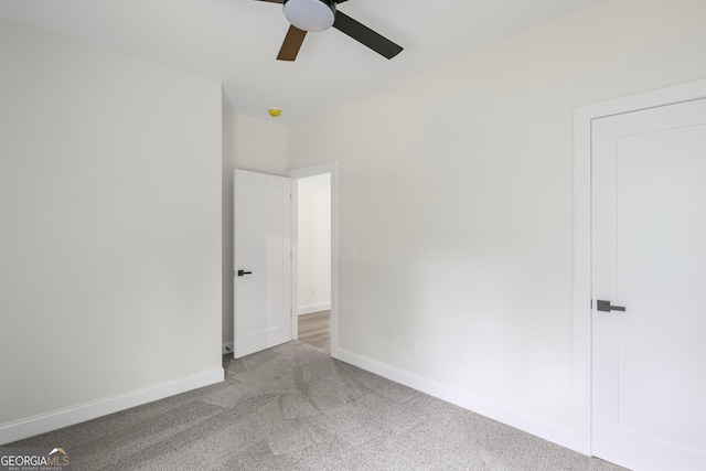 130 Rudders Xing, Newnan, GA 30263 - unfurnished bedroom with baseboards, carpet flooring, and ceiling fan