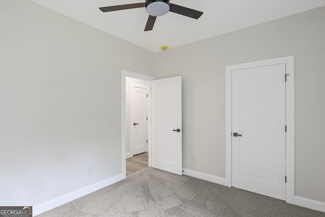 130 Rudders Xing, Newnan, GA 30263 - unfurnished bedroom with baseboards, carpet floors, and ceiling fan