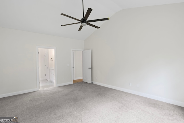 130 Rudders Xing, Newnan, GA 30263 - unfurnished bedroom featuring carpet, connected bathroom, baseboards, high vaulted ceiling, and ceiling fan