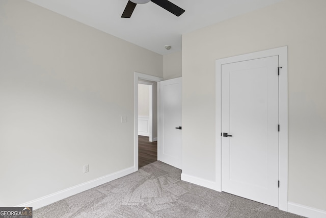 130 Rudders Xing, Newnan, GA 30263 - unfurnished bedroom featuring baseboards, carpet floors, and ceiling fan
