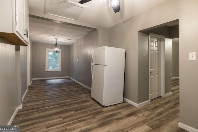 451 Woodlawn Dr, Crawford, GA 30630 - interior space featuring white cabinets, baseboards, dark wood-type flooring, and freestanding refrigerator