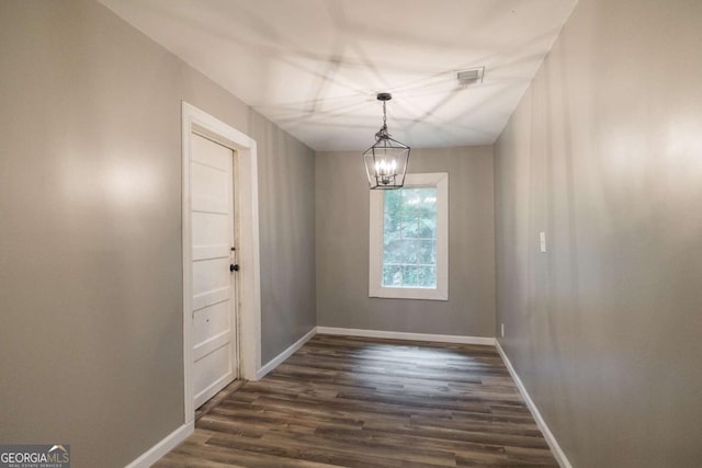 451 Woodlawn Dr, Crawford, GA 30630 - unfurnished dining area with dark wood-type flooring, a chandelier, visible vents, and baseboards