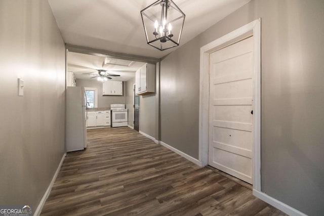 451 Woodlawn Dr, Crawford, GA 30630 - corridor featuring baseboards, dark wood-style floors, and an inviting chandelier