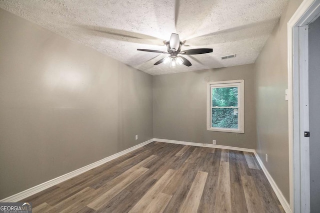 451 Woodlawn Dr, Crawford, GA 30630 - spare room with a textured ceiling, visible vents, baseboards, a ceiling fan, and wood finished floors