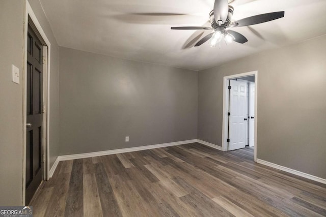 451 Woodlawn Dr, Crawford, GA 30630 - spare room featuring ceiling fan, baseboards, and dark wood-type flooring