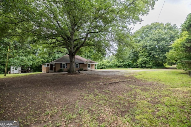 451 Woodlawn Dr, Crawford, GA 30630 - ranch-style house with a storage unit and an outdoor structure