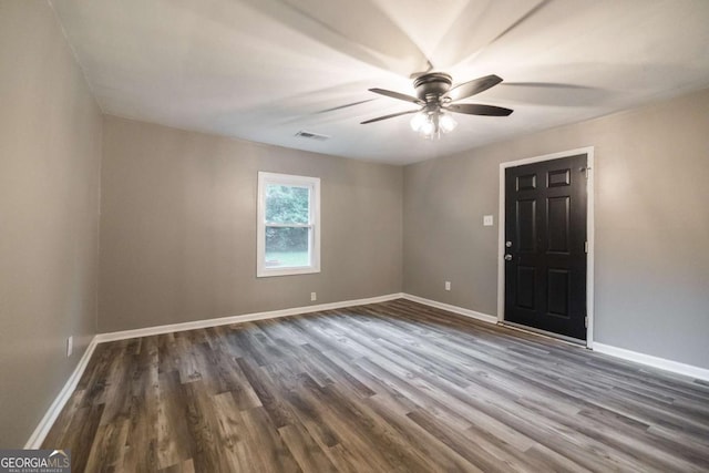 451 Woodlawn Dr, Crawford, GA 30630 - empty room with dark wood-style flooring, baseboards, ceiling fan, and visible vents