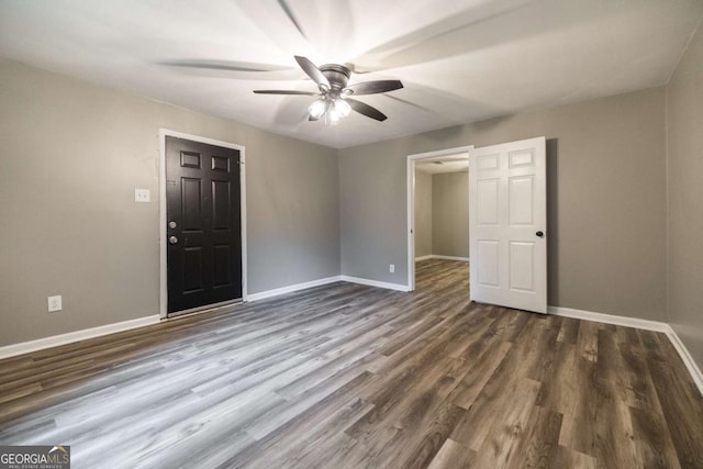 451 Woodlawn Dr, Crawford, GA 30630 - unfurnished room with baseboards, dark wood-style floors, and ceiling fan