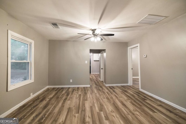 451 Woodlawn Dr, Crawford, GA 30630 - spare room featuring baseboards, visible vents, ceiling fan, and dark wood finished floors