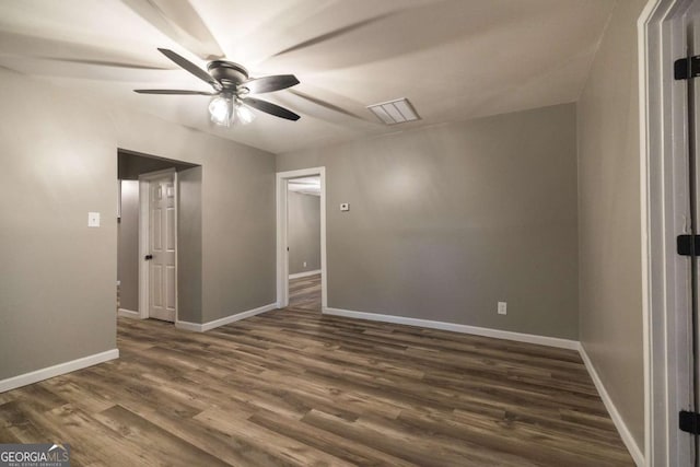 451 Woodlawn Dr, Crawford, GA 30630 - empty room featuring baseboards, a ceiling fan, and dark wood-type flooring
